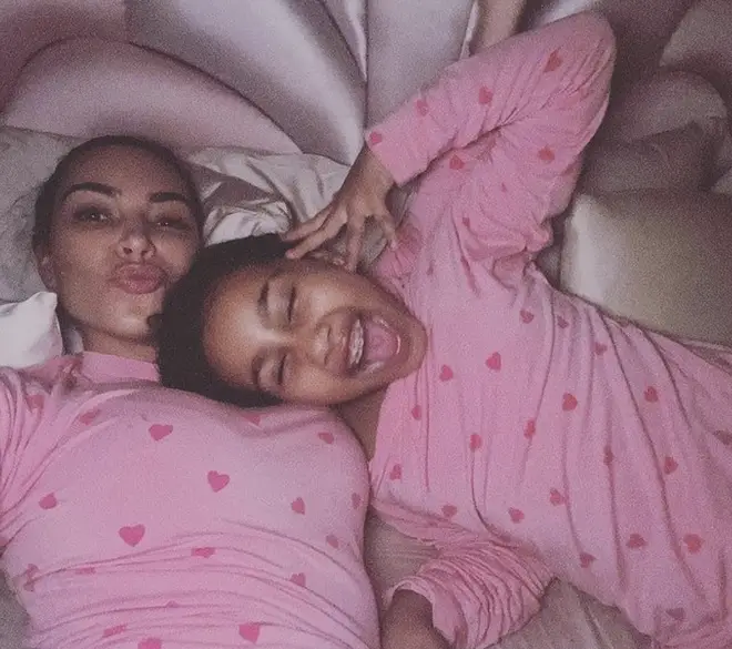 Kim Kardashian and North West take selfies in their pink pyjamas