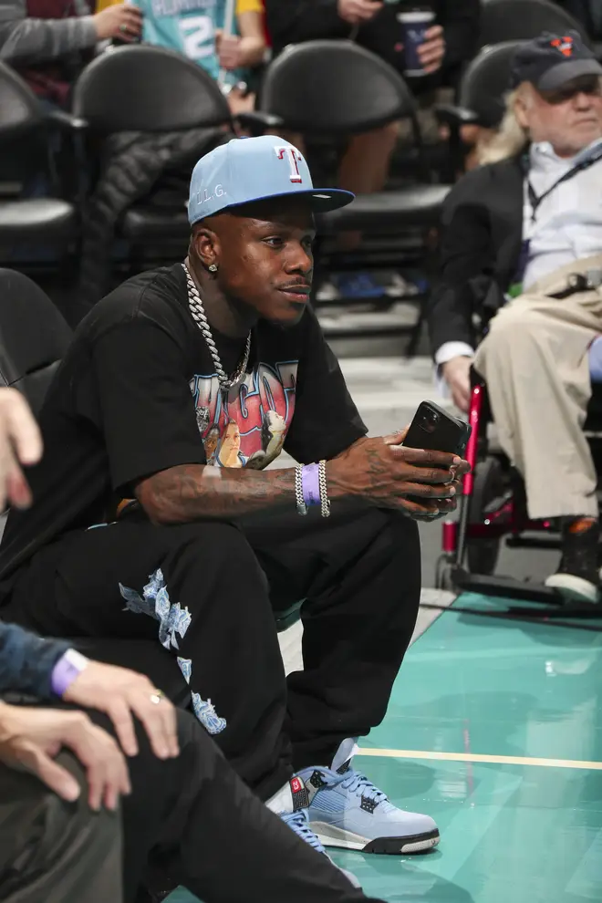 DaBaby attends a game between the Denver Nuggets and Charlotte Hornets on March 28, 2022 at Spectrum Center in Charlotte, North Carolina