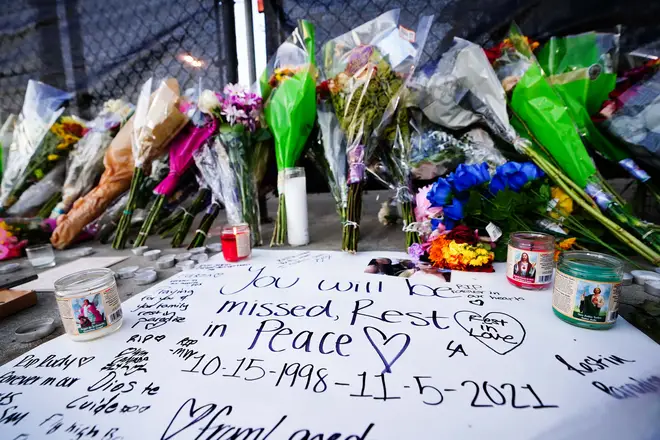 Candles, flowers and letters are placed at a memorial outside of the canceled Astroworld festival at NRG Park on November 7, 2021 in Houston, Texas