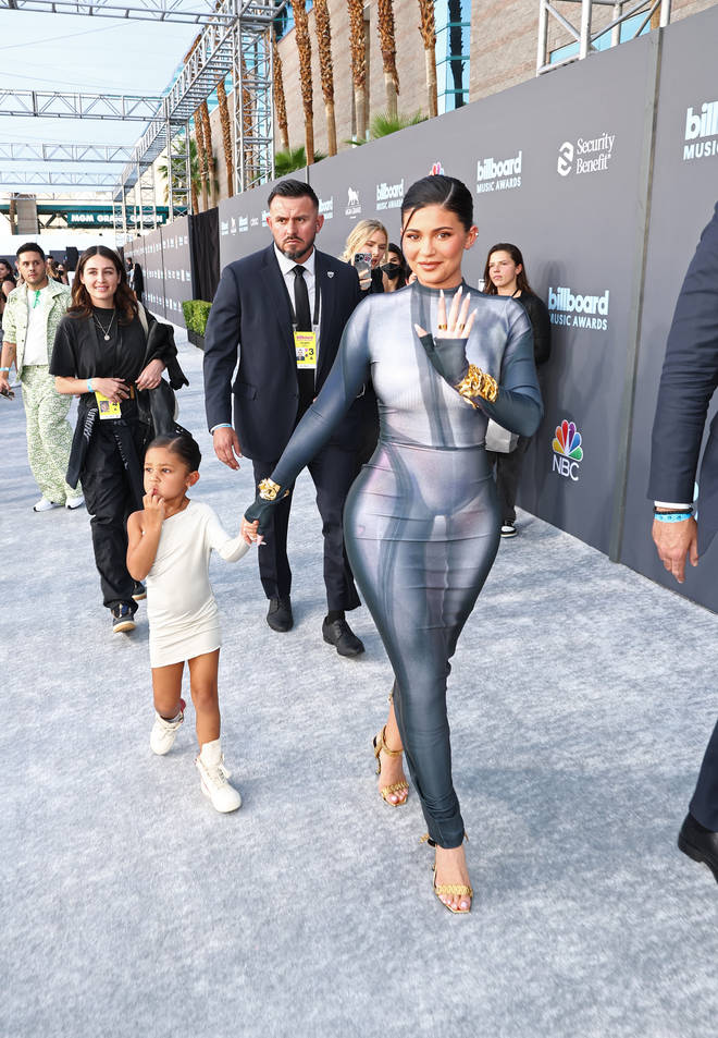 Stormi Webster and Kylie Jenner arrive at the 2022 Billboard Music Awards held at the MGM Grand Garden Arena on May 15, 2022