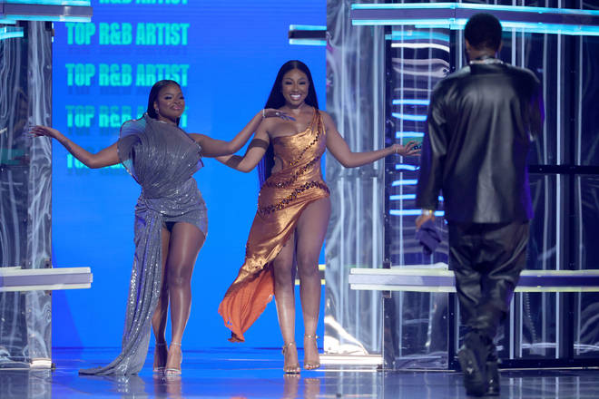 JT and Yung Miami of City Girls and Sean "Diddy" Combs speak onstage during the 2022 Billboard Music Awards at MGM Grand Garden Arena on May 15, 2022 in Las Vegas, Nevada