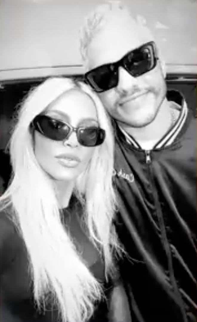 Kim Kardashian shares a video of her and beau Pete Davidson in matching all black outfits paired with black shades.