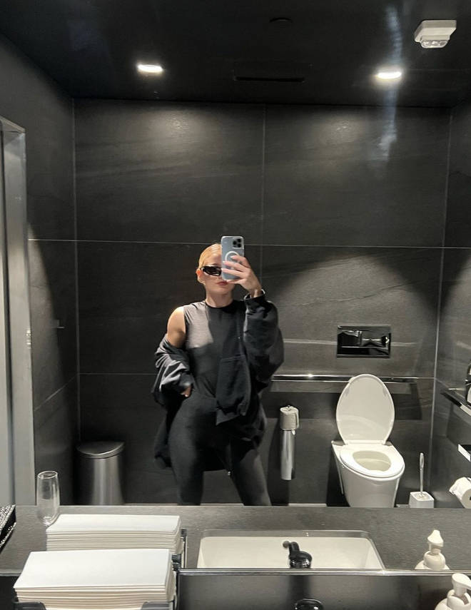 Monica Corgan poses in the bathroom mirror for a snap