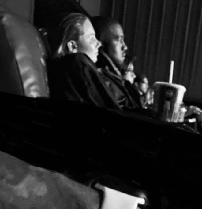 Kanye West was spotted with a blonde woman, who fans believe to be Monica Corgan, in a movie date.