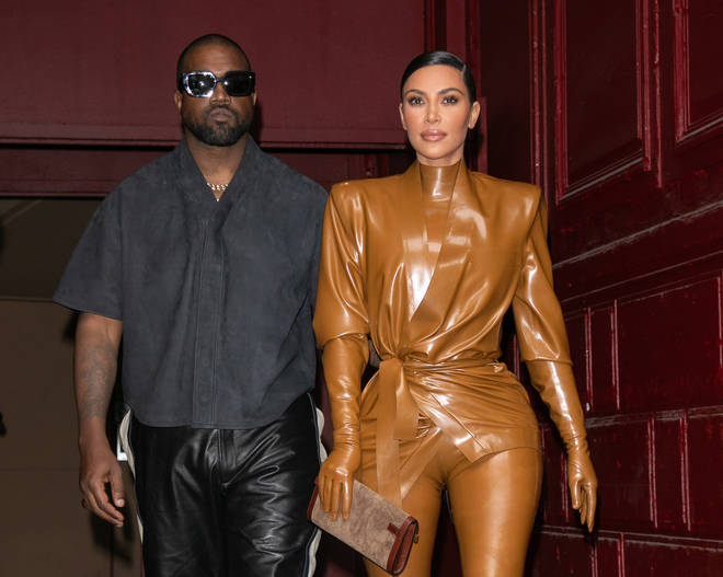 Kanye with his ex-wife Kim Kardashian last year