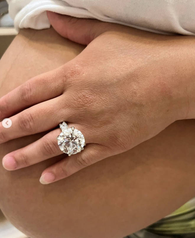 The image of the baby bump and ring.