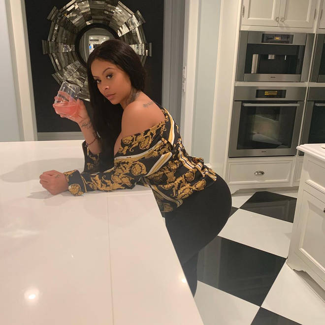 Alexis Skyy poses in Kris Jenner's monochromatic kitchen in her Calabasas mansion.