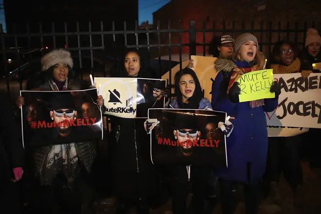 Protesters march to 'Mute R. Kelly' at his studio in Chicago