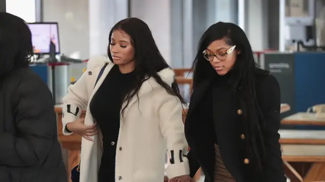 Azriel Clary and Jocelyn Savage held hands as they arrived for R Kelly's bond hearing