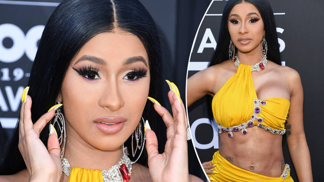Cardi B admitted she's not supposed to be performing after getting liposuction.