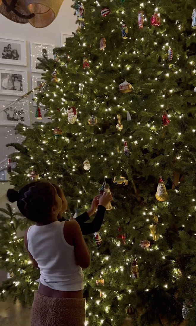 Stormi was among the decorators for the immense tree.