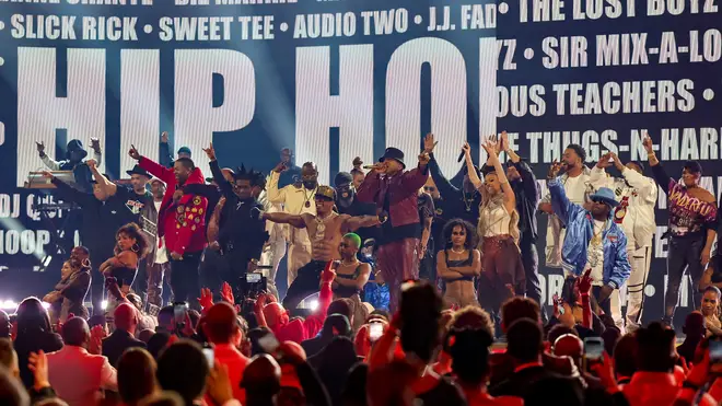 An array of rappers perform a tribute to the 50th anniversary of hip hop at the 65th Grammy Awards.
