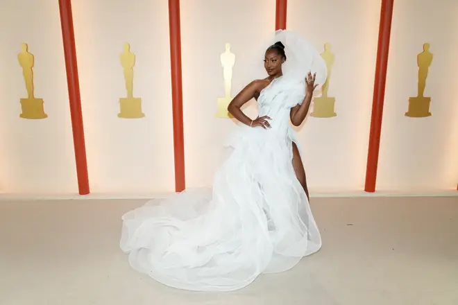 Tems wore this stunning white gown to the Oscars.