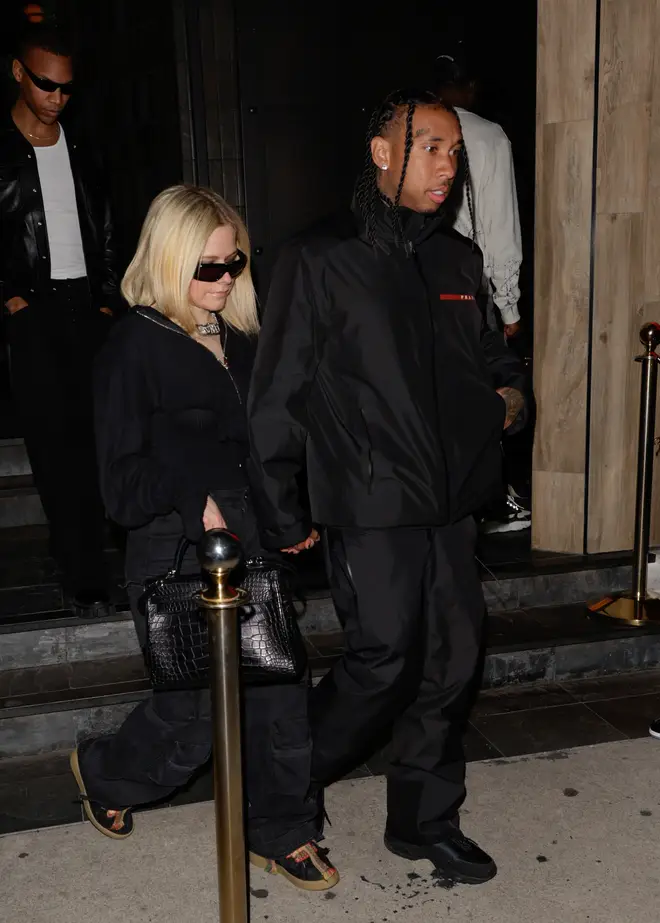 Avril was seen wearing the chain in this picture with Tyga last week.