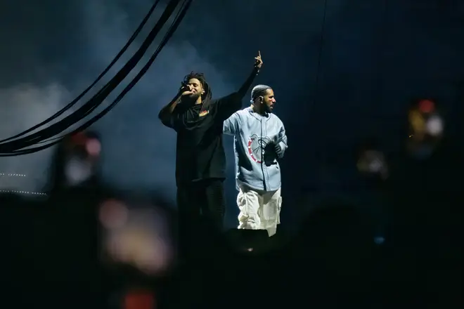 J. Cole (L) and Drake (R) perform during the Dreamville Festival.