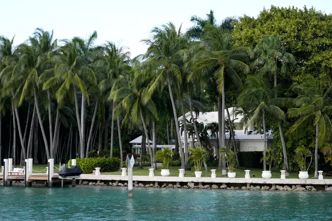 A property belonging to rapper Sean "Diddy" Combs is seen from the water during a search by federal law enforcement agents, Monday, March 25, 2024, on Star Island in Miami Beach, Fla. (AP Photo/Rebecca Blackwell)
