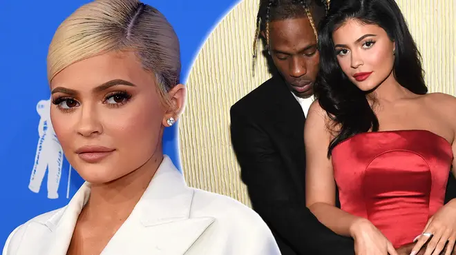 Kylie Jenner & Travis Scott have been spotted boarding a plane with a 'wedding dress' & 'suit'