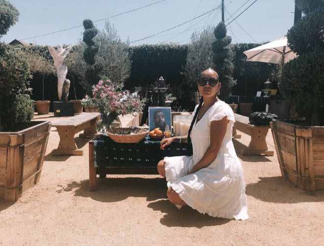 Lauren shared a photo of her next to a shrine dedicated to the late rapper.