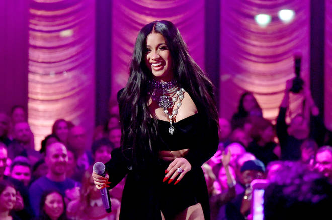 Cardi B performs onstage during the Warner Music Group Pre-Grammy Party.